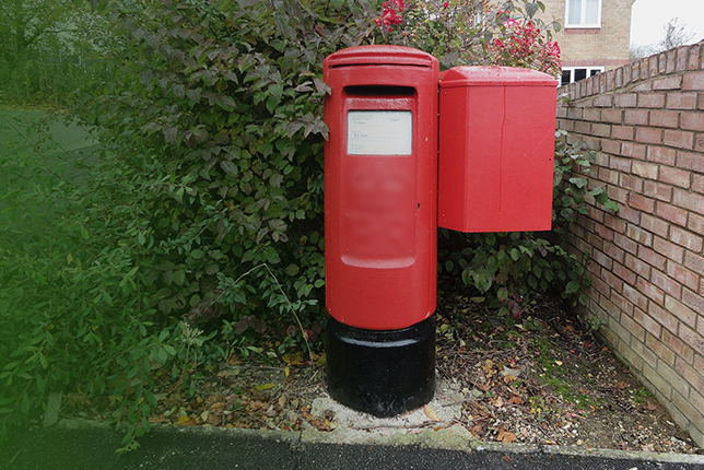 A close-up view of a traditional post box, representing postal services in Lahore."