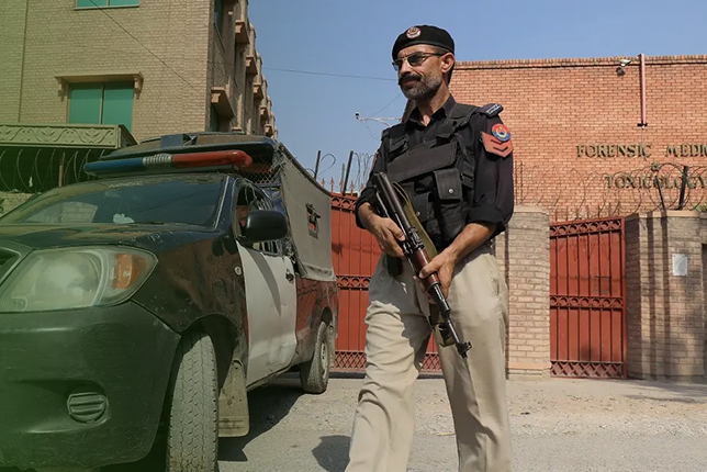 A police DSP in uniform, standing on duty.