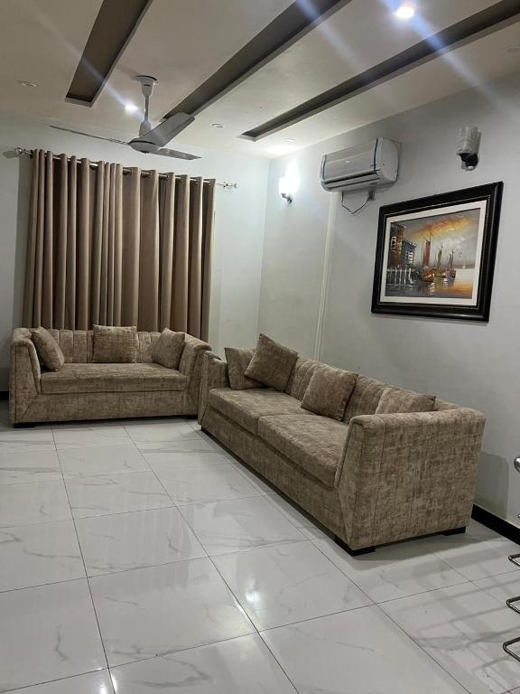 A furnished house in Bahria Town  Karachi with sofa sets