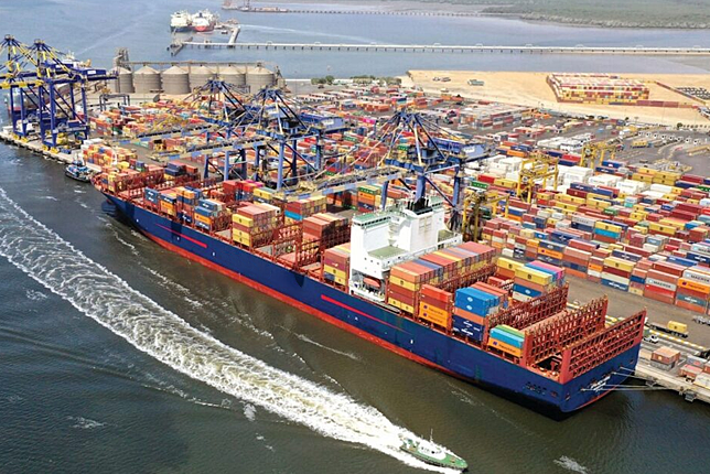 Aerial view of the Port of Karachi with container ships and cranes in action, showcasing its significance as Pakistan's largest commercial seaport.