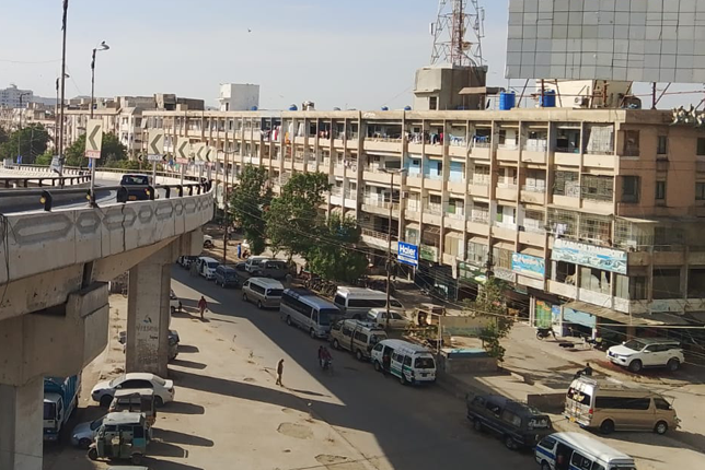 A bustling real estate office in North Karachi, showcasing investment opportunities.