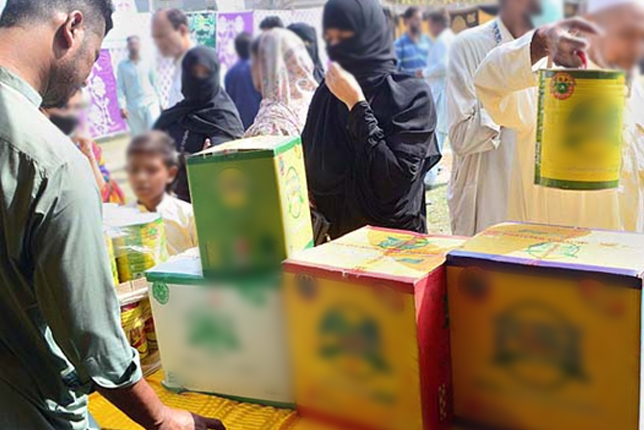 A low-income family receiving discounted groceries under the Punjab Ehsaas Rashan Riayat Program.