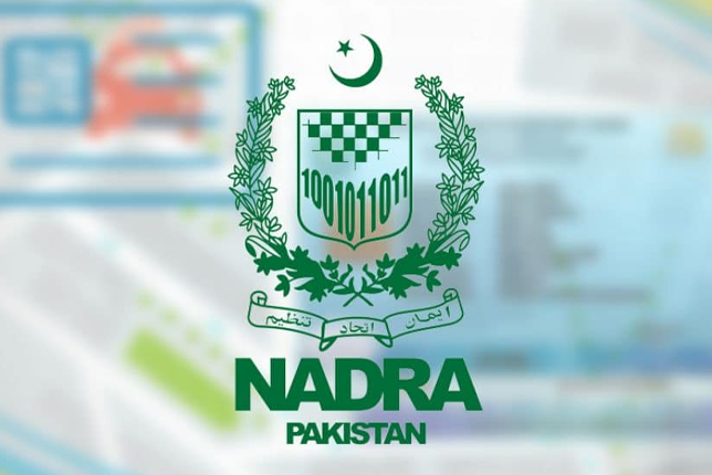 Organized desk with CNIC forms, blue-background photos, and a checklist for NADRA Multan visits